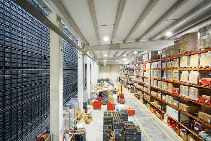 Large industrial warehouse interior; illustrative image of the Aerotropolis investment pipeline, not a named Western Sydney project.