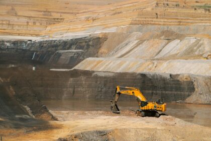 Excavator in an open-pit mine; illustrative image, not the McPhillamys Gold Project.